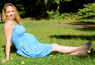 picture of pregnant female in a blue dress