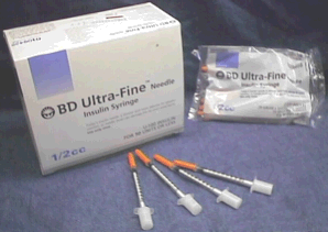 Image of an open box of syringes