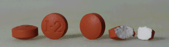 ibuprofen pills close up ibuprofen pills close up