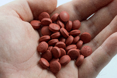 handful of ibuprofen pills
